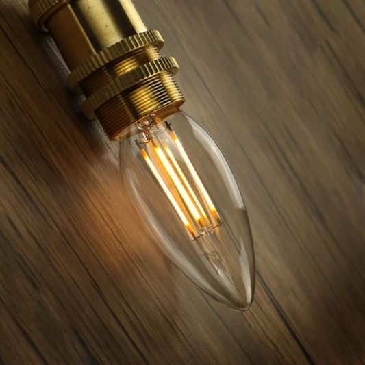 Tatva Lights E14 LED filament bulb with amber glow, vintage candle-shaped design, ideal for decorative lamps, wall sconces, and ambient home lighting.