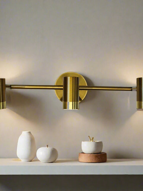 Tatva Lights Modern brass gold LED wall light with triple adjustable cylinder spotlights – ideal for contemporary interiors, vanity mirrors, and hallway lighting