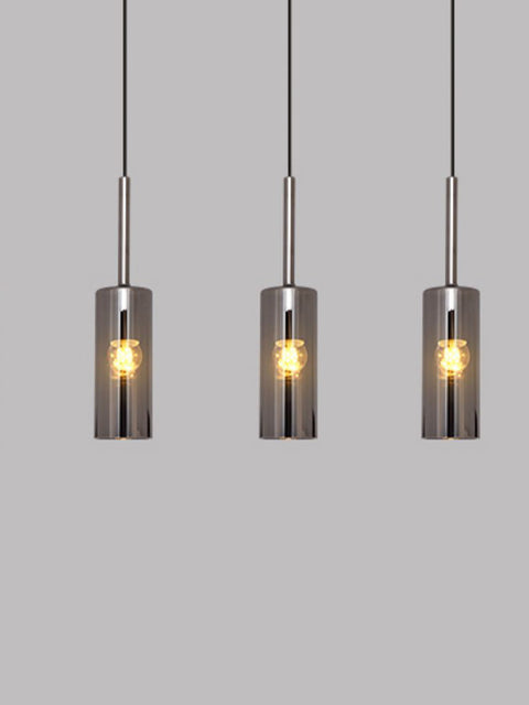 Tatva Lights Modern Pendant Drop featuring a sleek, elongated design with a minimalist metallic finish and soft LED illumination—ideal for kitchen islands, dining areas, or contemporary interior settings.