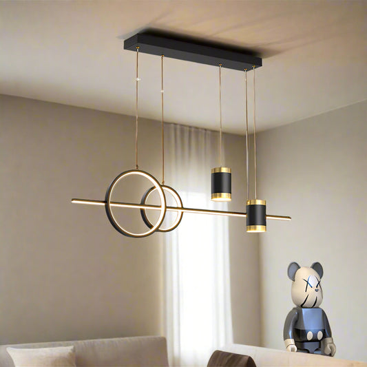 Tatva Lights modern geometric LED chandelier with circular and cylindrical pendant elements,  ideal for dining areas, living rooms, or contemporary interior spaces.