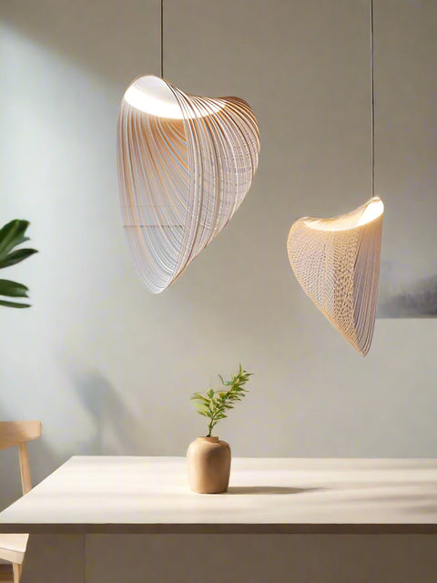 Tatva Lights Brionne Gold Chandelier featuring sculptural interlocking loops in a luxurious gold finish, suspended with slim cables for a floating effect—ideal for modern living rooms, dining spaces, or high-ceiling interiors.