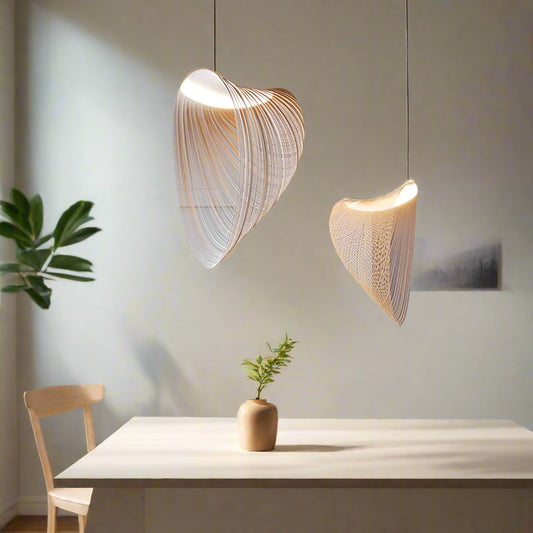 Tatva Lights Brionne Gold Chandelier featuring sculptural interlocking loops in a luxurious gold finish, suspended with slim cables for a floating effect—ideal for modern living rooms, dining spaces, or high-ceiling interiors.