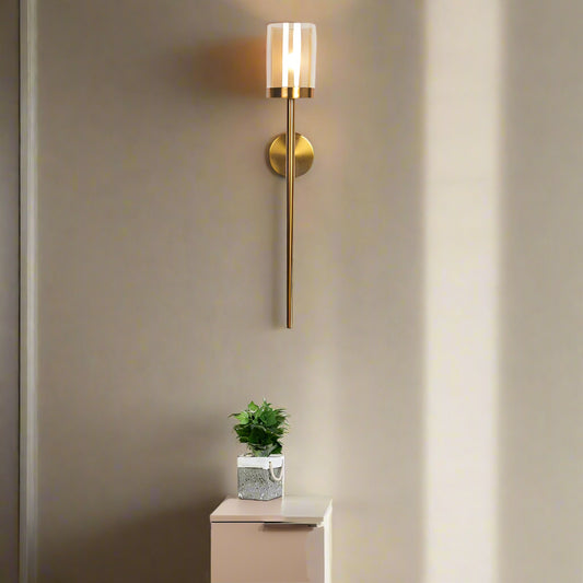 Tatva Lights Brivio Glass Iron Linear Wall Light – Sleek linear wall sconce with a clear glass diffuser and matte black iron frame, ideal for modern hallways, vanities, or contemporary bedroom lighting.