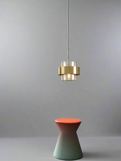 A modern LED crystal ball pendant ceiling light with a gold and white finish, hanging over a contemporary styled room.