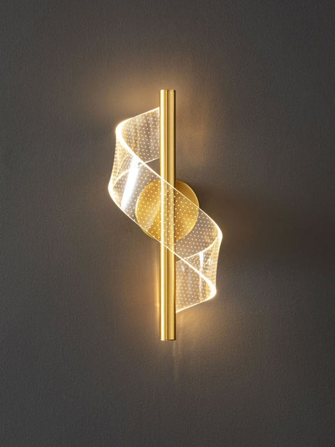 A modern industrial LED wall sconce with a gold finish and mesh diffuser, providing warm white illumination.