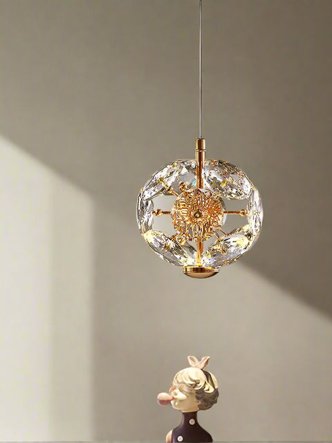 Tatva Lights Crystique Gold Pendant Chandelier features a luxurious gold frame adorned with cascading crystal accents, delivering a radiant and elegant glow—perfect for upscale dining rooms, living spaces, or entryways.