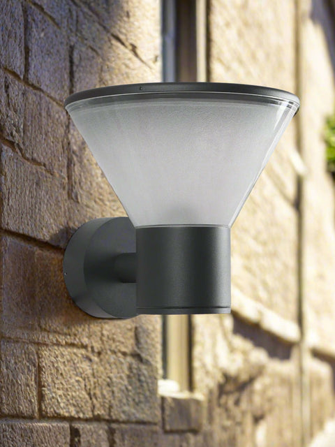 Tatva Lights Cylindrical Funnel Wall Sconce featuring a sleek black and gold finish with a tapered design, ideal for modern hallways, bedrooms, or living room accent walls.