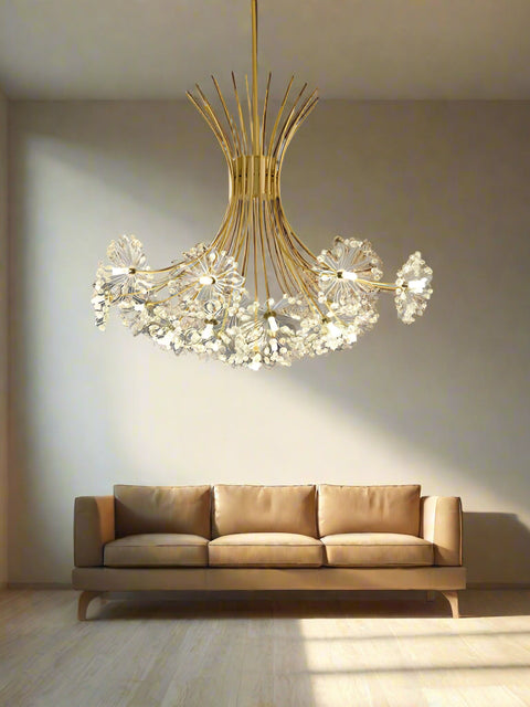 A contemporary gold chandelier with a complex structure hanging over a dining table, featuring clear glass decorations.