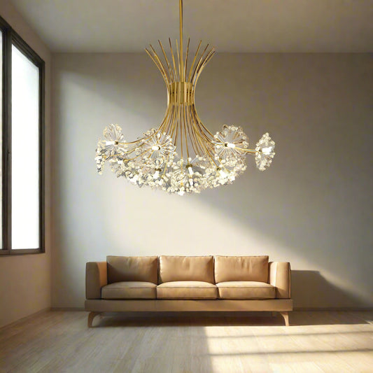 A contemporary gold chandelier with a complex structure hanging over a dining table, featuring clear glass decorations.