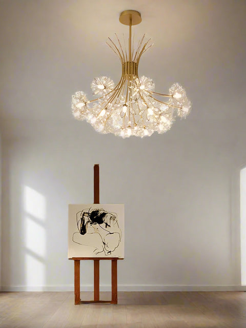 A contemporary 13-light LED luminaire chandelier with a gold-colored ceiling mount and multicolored lights, hanging in a bright room with modern decor.