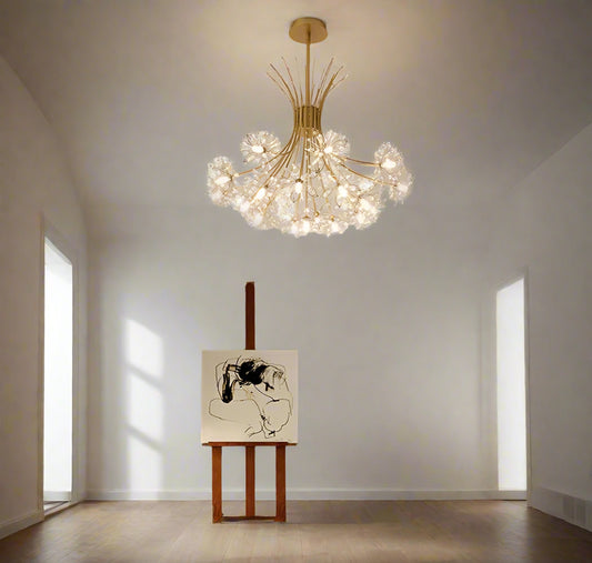 A contemporary 13-light LED luminaire chandelier with a gold-colored ceiling mount and multicolored lights, hanging in a bright room with modern decor.