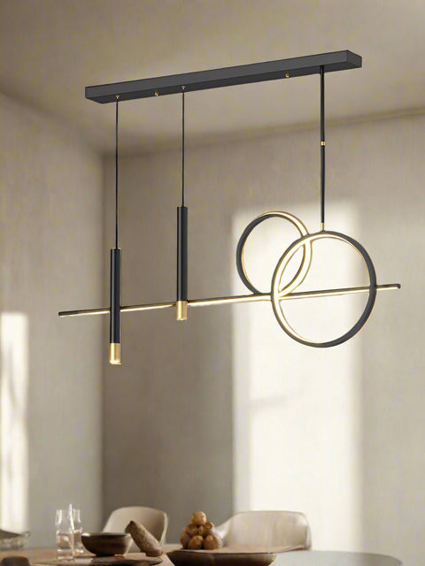 A modern black LED chandelier pendant light with five light fixtures, hanging over a kitchen island.