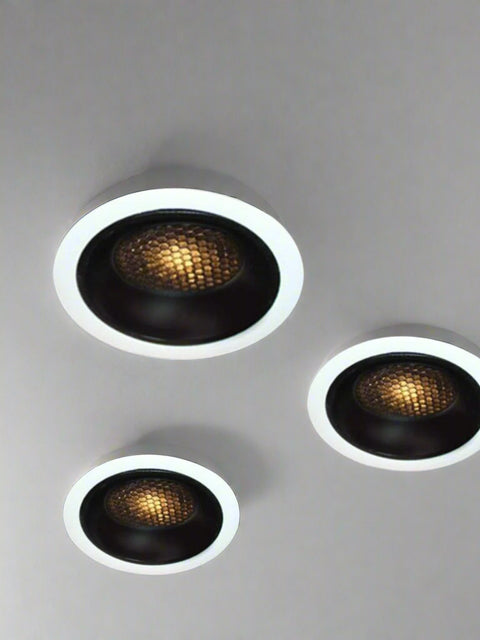 Tatva Lights Essence Recessed LED Downlight featuring a black honeycomb reflector with white trim, designed for glare-free illumination and modern aesthetics. Ideal for residential and commercial ceilings, offering focused, ambient LED lighting.