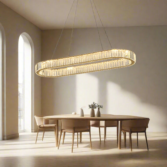 Tatva Lights Florenza Raindrop Chandelier featuring cascading crystal raindrop elements suspended from a polished gold frame with integrated LED lighting—ideal for grand foyers, staircases, or luxurious dining spaces.