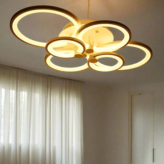 Tatva Lights Florize Hexa Chandelier featuring a geometric hexagonal arrangement of crystal-embedded rings with a gold finish and integrated LED lights—ideal for contemporary living rooms, dining spaces, or high-ceiling entryways seeking a bold yet elegant statement.