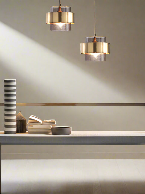 Tatva Lights Glimmer Halo Pendant – a modern dual-shade chandelier with a brushed gold exterior and frosted textured inner glass, designed to add ambient elegance to living and workspaces