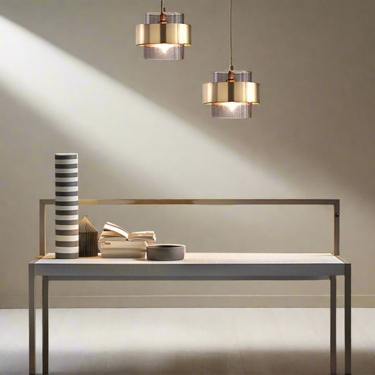 Tatva Lights Glimmer Halo Pendant – a modern dual-shade chandelier with a brushed gold exterior and frosted textured inner glass, designed to add ambient elegance to living and workspaces