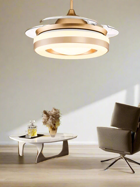 Tatva Lights Golden Ceiling Fan Chandelier with Remote Control featuring an elegant gold finish, integrated LED lighting, and retractable blades—ideal for adding luxury and functionality to modern living rooms, bedrooms, or dining areas.