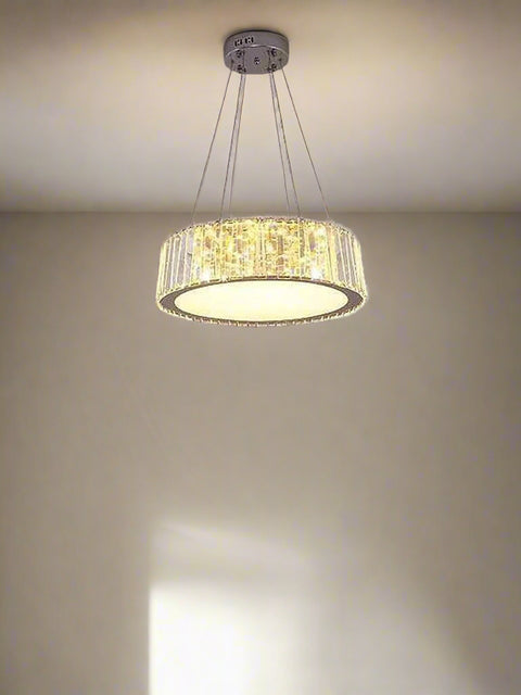 cascading crystal elements and integrated LED lighting. Suspended from the ceiling by sleek wires, this chandelier adds a sophisticated and radiant focal point to upscale interiors such as living rooms, dining areas, or grand entryways.