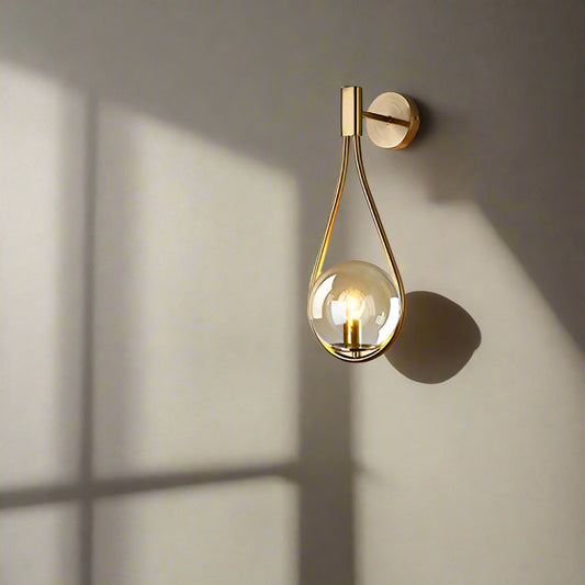 Tatva Lights – Leaf Ring Modern LED Chandelier featuring an elegant circular design inspired by natural leaf patterns, integrated warm LED lighting, and a luxurious gold finish, perfect for modern living or dining spaces.