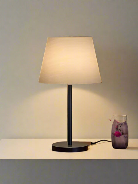 Tatva Lights Luxury Black Table Lamp with a matte black finish, sleek metallic accents, and a modern minimalist silhouette—ideal for bedside tables, work desks, or contemporary living spaces.