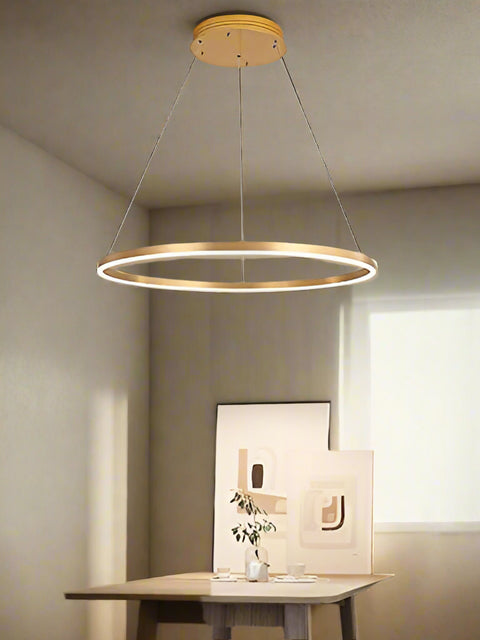 Tatva Lights Mirelle Gold Ring Chandelier – Contemporary circular LED chandelier with a sleek gold finish and minimalist design, perfect for modern dining rooms, living areas, or statement entryways