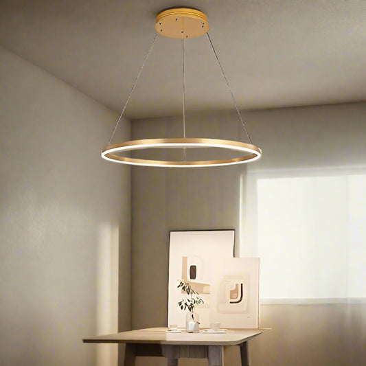 Tatva Lights Mirelle Gold Ring Chandelier – Contemporary circular LED chandelier with a sleek gold finish and minimalist design, perfect for modern dining rooms, living areas, or statement entryways