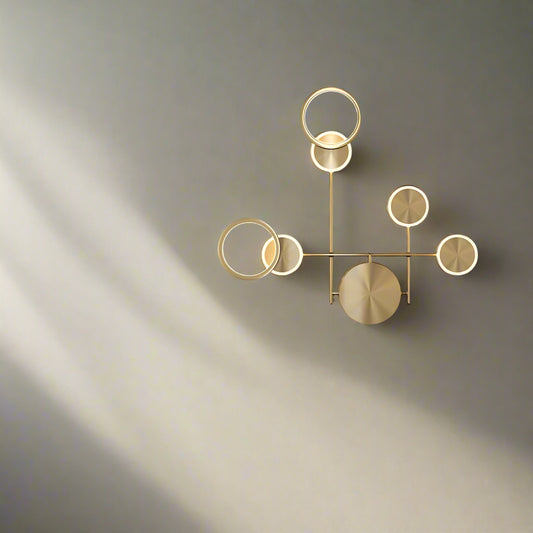 A modern industrial wall sconce with a retro wood glass shade, featuring warm white LED lighting, mounted on a wall in a dark room beside a chair and below a plant.
