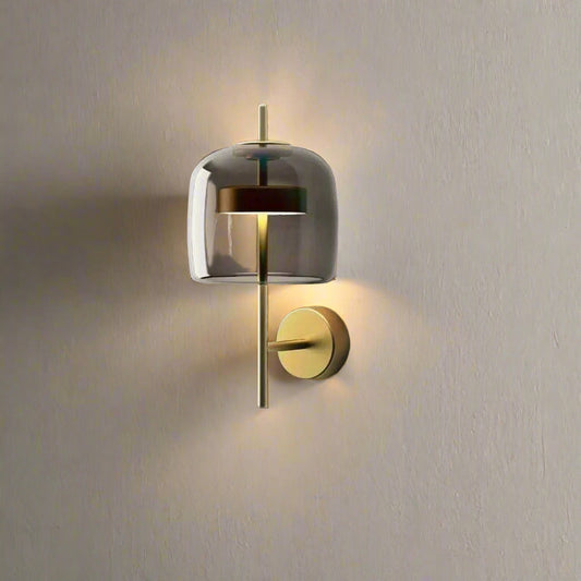 Tatva Lights Modern Zen Wall Light โ minimalist gold wall fixture with vertical crystal elements and a smooth curved accent, offering a serene ambient glow. Ideal for contemporary interiors, spa-inspired spaces, and calming wall dรฉcor.