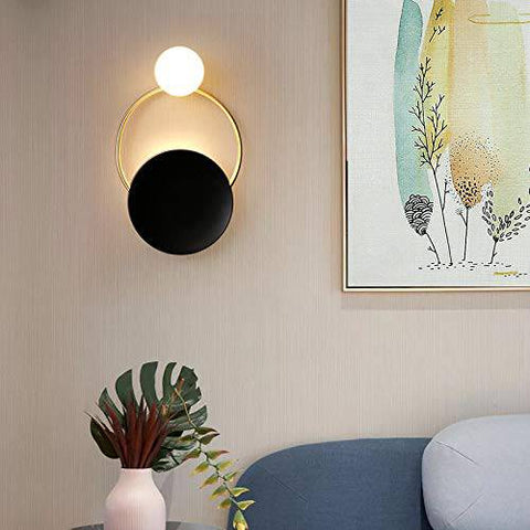 Tatva Lights Nocturne Glow Wall Sconce featuring a sleek, minimalist silhouette with a soft ambient LED glow and matte metallic finish—perfect for modern bedrooms, hallways, or serene accent lighting.