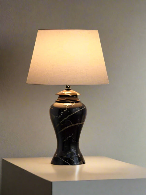 Tatva Lights Nocturra Stone Black Table Lamp – a modern table lamp featuring a textured black stone-finish base with a minimalist silhouette, perfect for bedside tables, study desks, or accent lighting in contemporary interiors.