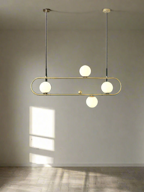 Tatva Lights Opulent Raindrop Chandelier showcases cascading crystal droplets suspended from a polished gold base, creating a luxurious rain-inspired design perfect for grand foyers, staircases, or high-ceiling living spaces.