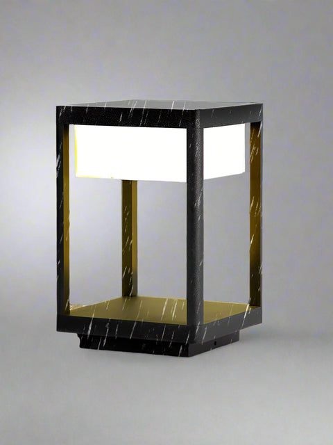 Tatva Lights Outdoor Pillar Lantern featuring a robust weather-resistant frame with clear glass panels and warm LED lighting—perfect for illuminating garden paths, gateposts, or patio pillars in modern outdoor settings.
