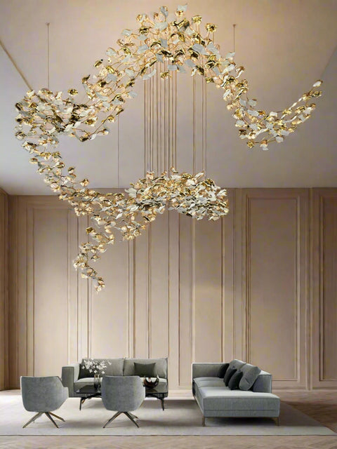 Tatva Lights – Shunya Chandelier featuring a striking circular design with suspended LED rings, exuding a sense of minimal elegance and modern sophistication. Finished in a premium metallic tone, perfect for double-height spaces or statement ceilings.