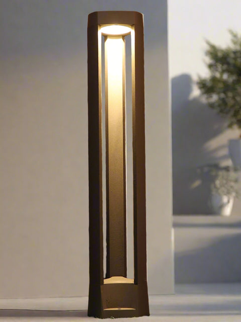 Tatva Lights Stratos Bollard – a sleek outdoor LED pathway light with a minimalist open-frame design and warm vertical illumination, perfect for modern landscapes and garden walkways.
