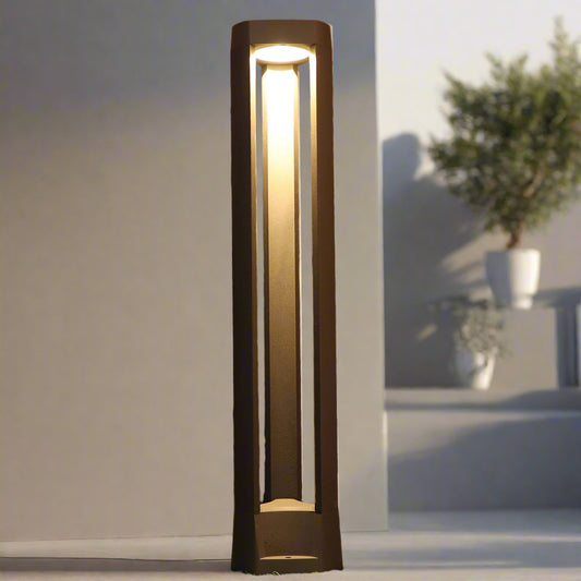 Tatva Lights Stratos Bollard – a sleek outdoor LED pathway light with a minimalist open-frame design and warm vertical illumination, perfect for modern landscapes and garden walkways.