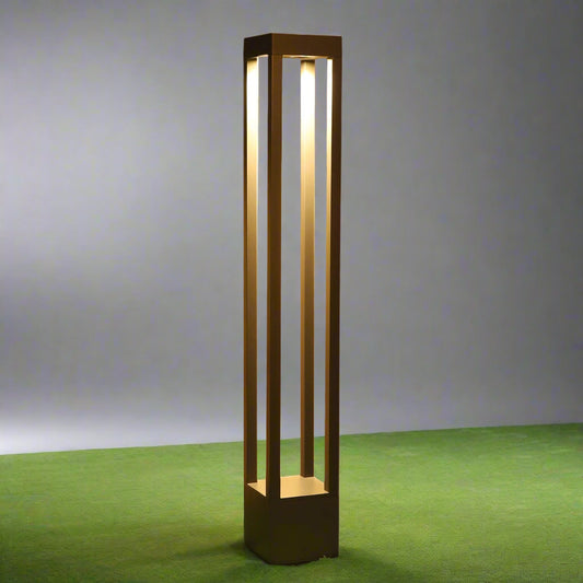 Tatva Lights – Striade Outdoor Light featuring a sleek, minimalist design with a vertical slatted pattern. Crafted for durability and style, this LED wall fixture casts a warm white glow, perfect for enhancing modern outdoor spaces such as balconies, gardens, and entrances.