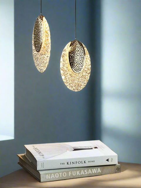 **Alt Text:**
Tatva Lights Tinsel Hoop LED Pendant Light featuring a sleek circular design with a warm white glow, suspended by adjustable cords—ideal for dining areas, modern living rooms, or elegant office interiors.