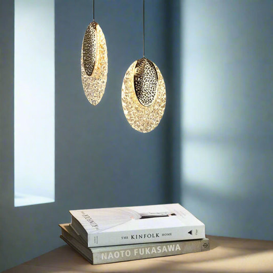 **Alt Text:**
Tatva Lights Tinsel Hoop LED Pendant Light featuring a sleek circular design with a warm white glow, suspended by adjustable cords—ideal for dining areas, modern living rooms, or elegant office interiors.