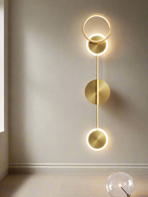 Tatva Lights Trivara Wall Light – Contemporary triple-arm LED wall sconce with a sleek gold and black finish, ideal for modern living rooms, bedrooms, hallways, or statement accent walls