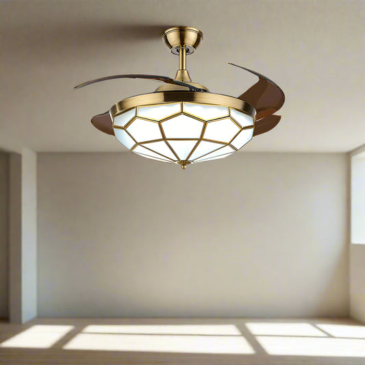 Tatva Lights Vintage Crystal Ceiling Fan with Light featuring a stunning gold geometric crystal diffuser and retractable blades.
Combines elegant chandelier lighting with a quiet, high-performance ceiling fan for living or dining rooms.
Perfect fusion of style and utility for modern or vintage-inspired interiors seeking luxury ceiling decor.