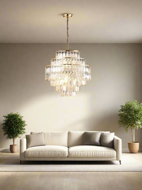 Tatva Lights White Husks Chandelier illuminating a modern living room with layered teardrop crystal design, perfect for luxury interiors, drawing rooms, and statement ceiling lighting décor.