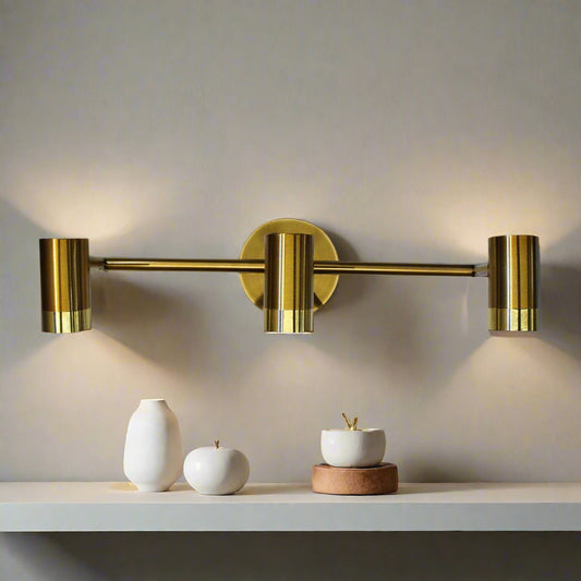 Tatva Lights Modern brass gold LED wall light with triple adjustable cylinder spotlights – ideal for contemporary interiors, vanity mirrors, and hallway lighting