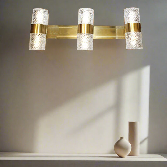 Luxury crystal glass wall light with gold metallic frame – elegant dual-headed design for premium home or hotel interiors by Tatva Lights.