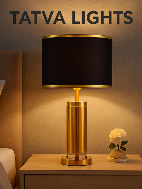 Tatva Lights Signature Black & Gold Crystal Table Lamp placed on a bedside table, featuring a luxurious golden base with a sleek black drum shade, ideal for modern bedrooms and living room decor.