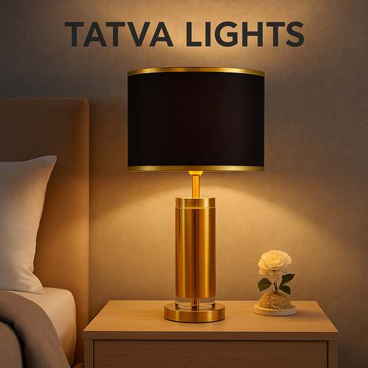 Tatva Lights Signature Black & Gold Crystal Table Lamp placed on a bedside table, featuring a luxurious golden base with a sleek black drum shade, ideal for modern bedrooms and living room decor.