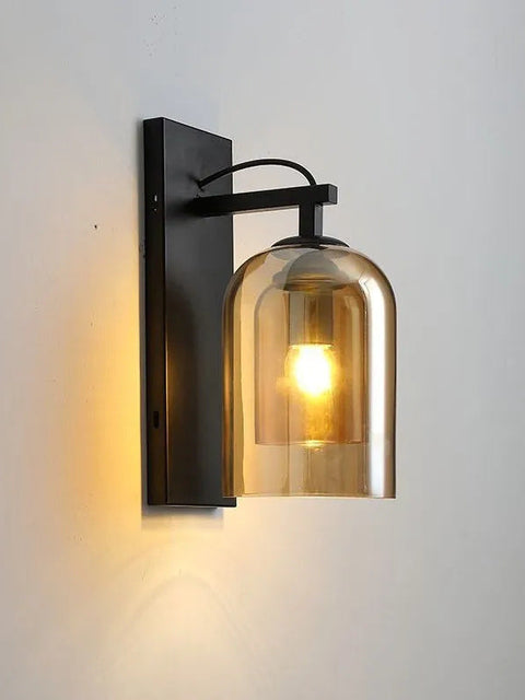 Tatva Lights Aureo Glass Globe Wall Light featuring a gold-finished frame and frosted glass sphere, ideal for adding a warm, ambient glow to bedrooms, hallways, and modern living spaces.
