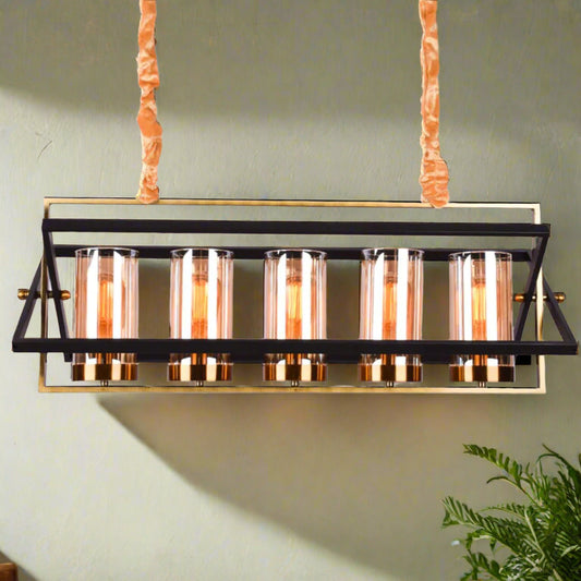Modern Tatva VaultLine industrial-style chandelier with 6 cylindrical amber glass shades and matte black metal frame, ideal for dining rooms, lofts, and kitchen islands