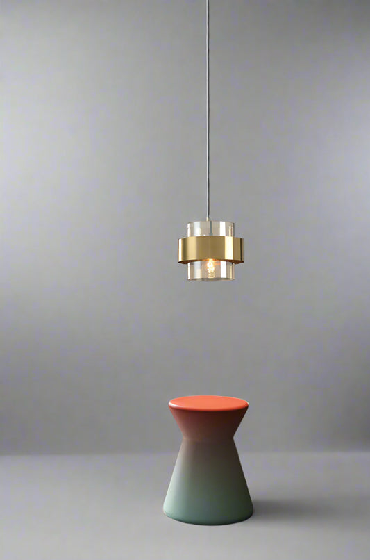 A modern LED crystal ball pendant ceiling light with a gold and white finish, hanging over a contemporary styled room.