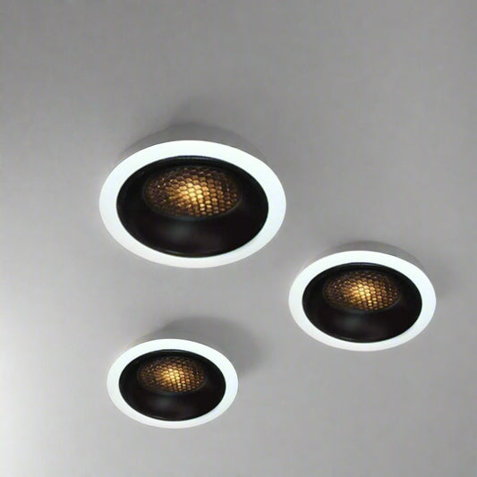 Tatva Lights Essence Recessed LED Downlight featuring a black honeycomb reflector with white trim, designed for glare-free illumination and modern aesthetics. Ideal for residential and commercial ceilings, offering focused, ambient LED lighting.